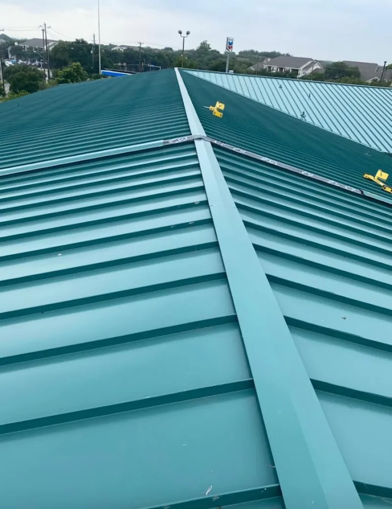 Green commercial metal roof ridge and valley for Metal Roof Repair in Lamar