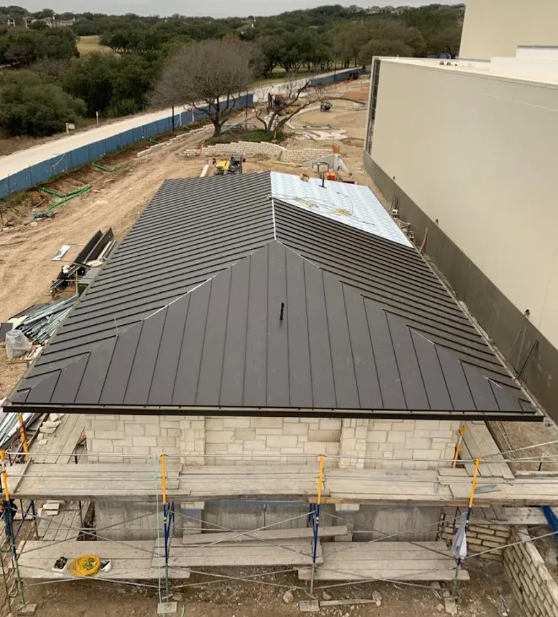 Metal roof new construction with scaffolding in Lamar